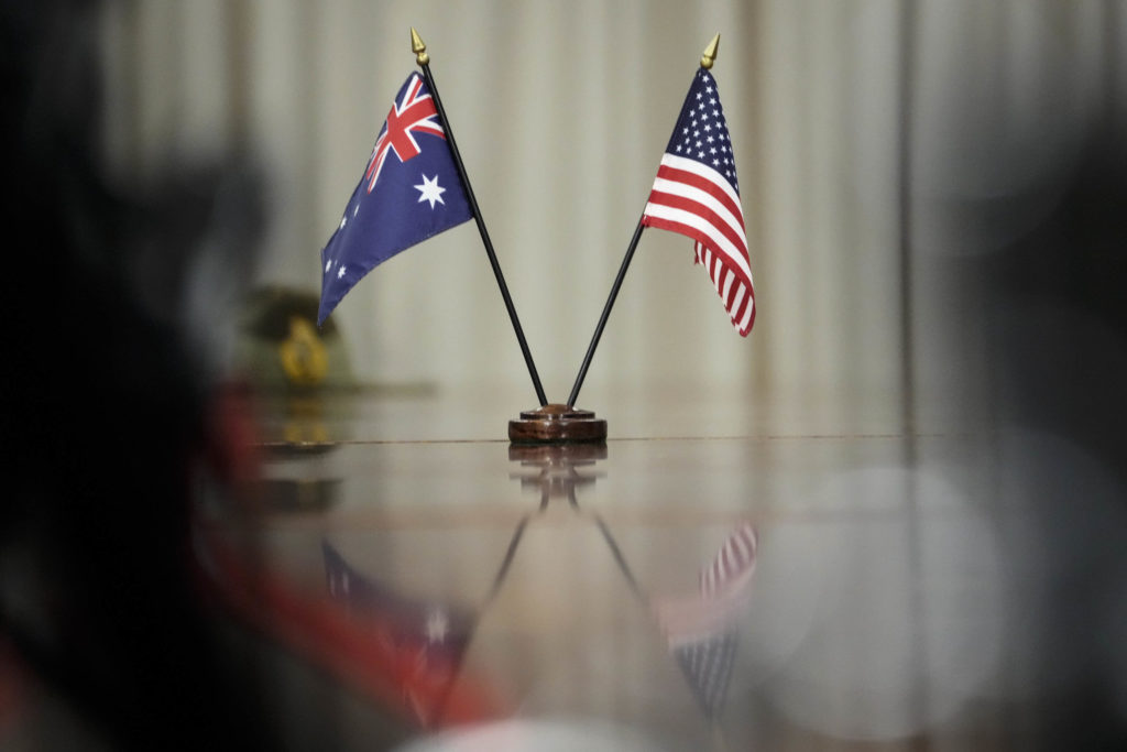 ARLINGTON, VA - SEPTEMBER 22: Australian and American flags sit on the table during a meeting between Prime Minister of Australia Scott Morrison and U.S. Secretary of Defense Lloyd Austin  at the Pentagon on September 22, 2021 in Arlington, Virginia. Last week, Australia, the United States and the United Kingdom announced a security pact (AUKUS) to help Australia develop and deploy nuclear-powered submarines, in addition to other military cooperation. (Photo by Drew Angerer/Getty Images)