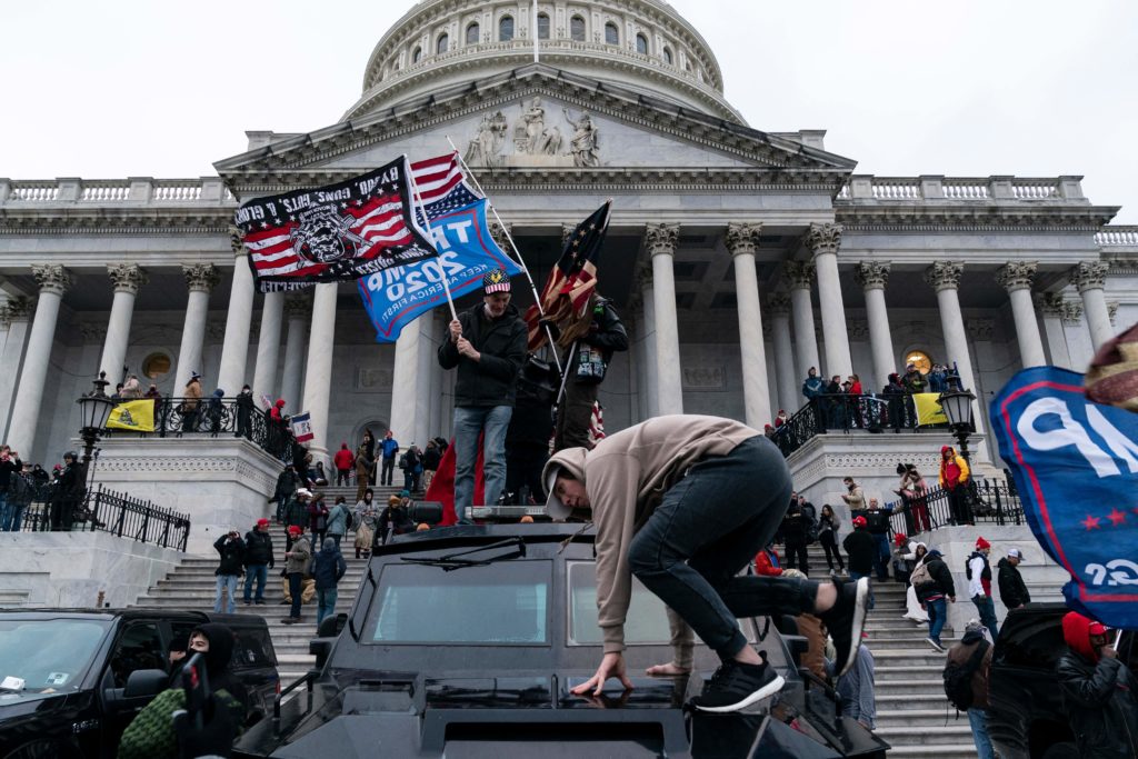 TOPSHOT - Supporters of US President Donald Trump protest outside the US Capitol on January 6, 2021, in Washington, DC. - Demonstrators breeched security and entered the Capitol as Congress debated the a 2020 presidential election Electoral Vote Certification. (Photo by ALEX EDELMAN / AFP) (Photo by ALEX EDELMAN/AFP via Getty Images)