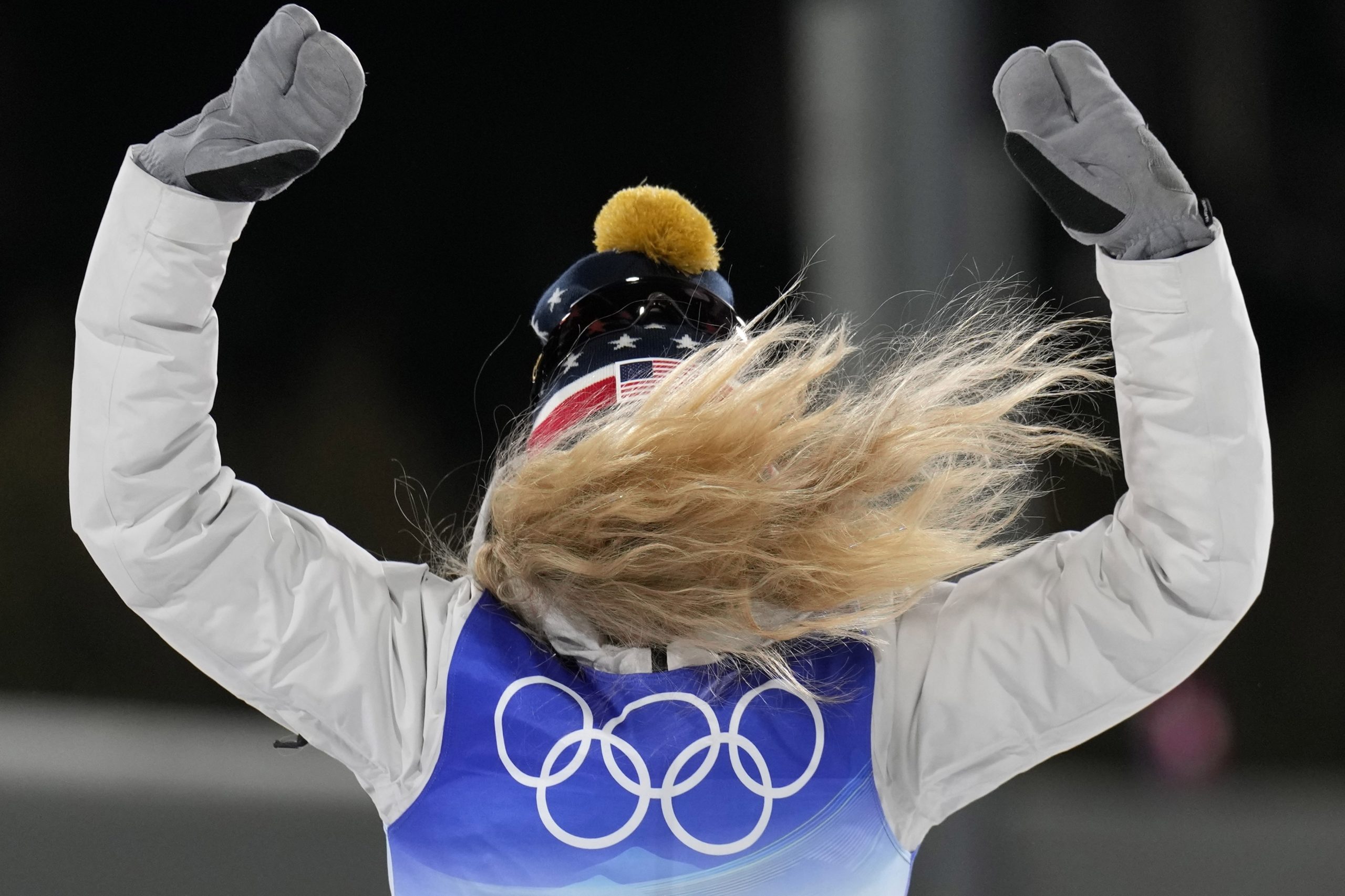 Jessie Diggins celebrates during a venue ceremony after winning the bronze medal in the women's sprint free cross-country skiing competition at the 2022 Winter Olympics, Tuesday, Feb. 8, 2022, in Zhangjiakou, China. (AP Photo/Alessandra Tarantino)