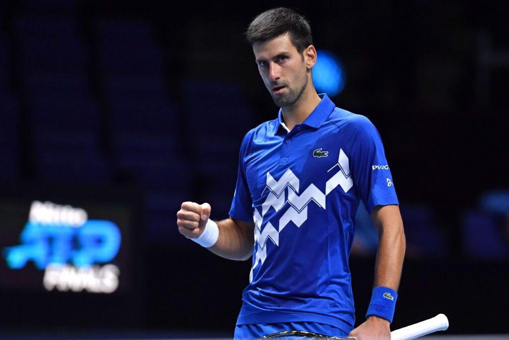 Serbia's Novak Djokovic reacts as he beats Germany's Alexander Zverev in straight sets in their men's singles round-robin match on day six of the ATP World Tour Finals tennis tournament at the O2 Arena in London on November 20, 2020. (Photo by Glyn KIRK / AFP) (Photo by GLYN KIRK/AFP via Getty Images)