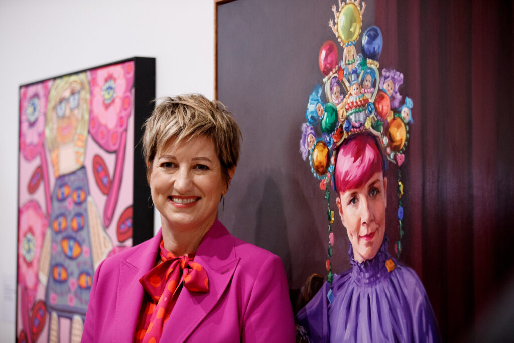 Artist Andrea Huelin and with her portrait of comedian Cal Wilson which has won the Archibald Packing Room Prize at the Art Gallery of NSW, Sydney Thursday, April 27, 2023.  (AAP Image/Nikki Short) NO ARCHIVING