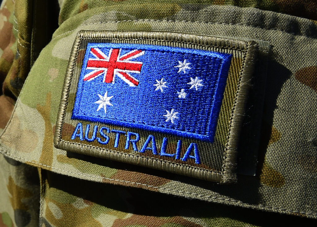 The Australian flag is seen on an Australian Defence Force (ADF) uniform at the Gallipoli Barracks in Brisbane, Tuesday, April 21, 2015.  (AAP Image/Dave Hunt) NO ARCHIVING