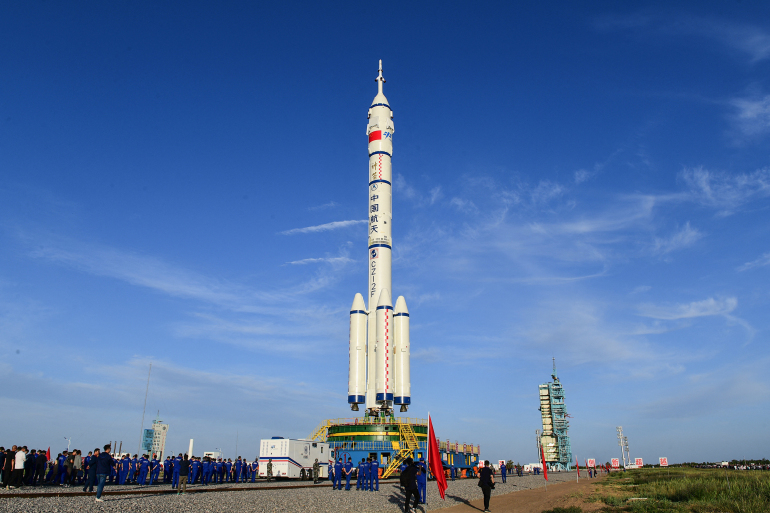 This photo taken on June 9, 2021 shows a Long March-2F carrier rocket, carrying the Shenzhou-12 spacecraft for China's first manned mission scheduled for June 17 to its new space station, at the Jiuquan Satellite Launch Centre in the country's northwestern Gansu province. (Photo by STR / China News Service (CNS) / AFP) / China OUT