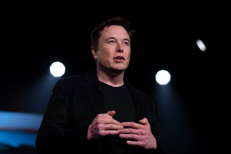 FILE - In this March 14, 2019, file photo, Tesla CEO Elon Musk speaks before unveiling the Model Y at the company's design studio in Hawthorne, Calif. In the runup to Tesla Inc.’s 2016 acquisition of SolarCity, Elon Musk called the combination a “no brainer,” a one-stop shop for electric cars and the solar panels to recharge them. On Monday, July 12, 2021, the Tesla CEO will have to defend the $2.5 billion deal under oath in a shareholder lawsuit alleging conflicts of interest. (AP Photo/Jae C. Hong, File)