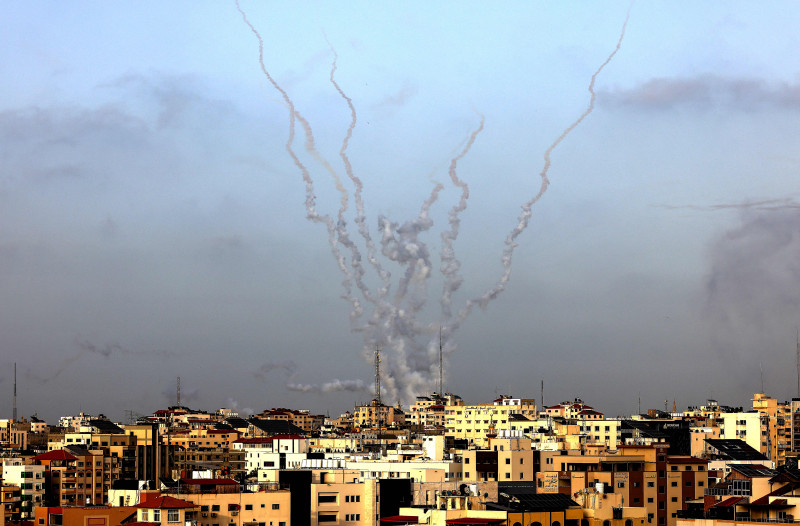 TOPSHOT - Rockets are fired from Gaza City, controlled by the Palestinian Islamist movement Hamas, towards Israel on May 10, 2021. (Photo by MAHMUD HAMS / AFP) (Photo by MAHMUD HAMS/AFP via Getty Images)