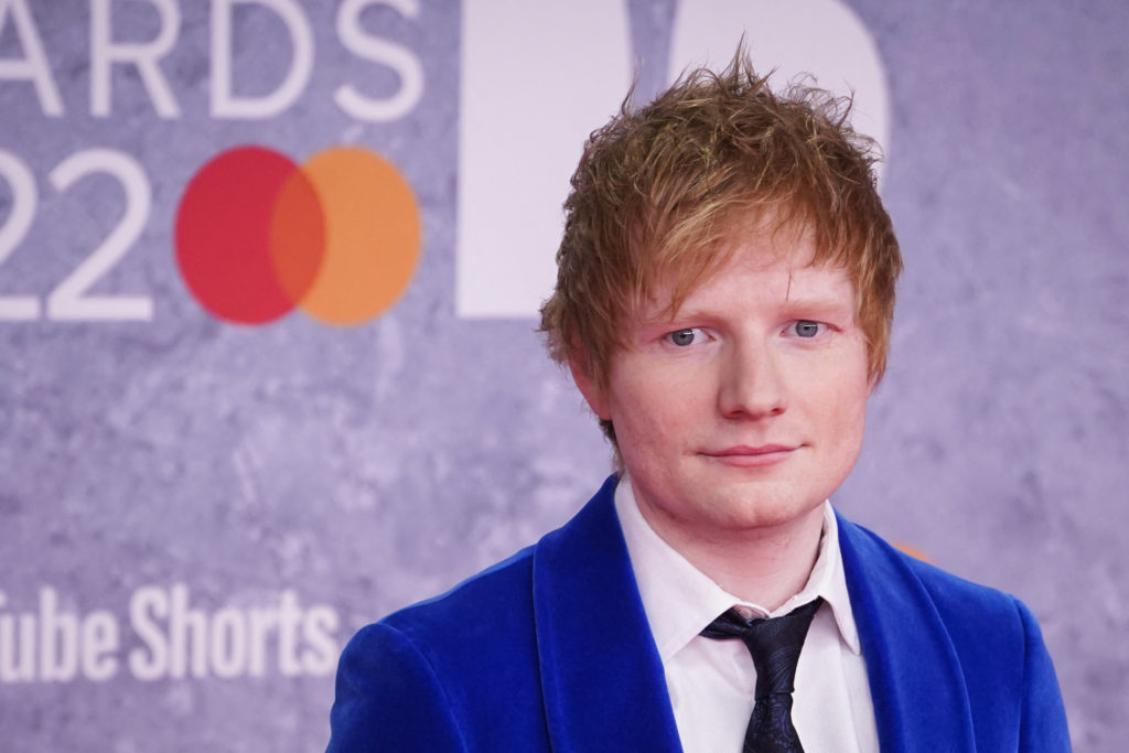 British singer and songwriter Edward Christopher Sheeran aka Ed Sheeran  poses on the red carpet upon his arrival for the BRIT Awards 2022 in London on February 8, 2022. - RESTRICTED TO EDITORIAL USE  NO POSTERS  NO MERCHANDISE NO USE IN PUBLICATIONS DEVOTED TO ARTISTS (Photo by Niklas HALLE'N / AFP) / RESTRICTED TO EDITORIAL USE  NO POSTERS  NO MERCHANDISE NO USE IN PUBLICATIONS DEVOTED TO ARTISTS (Photo by NIKLAS HALLE'N/AFP via Getty Images)