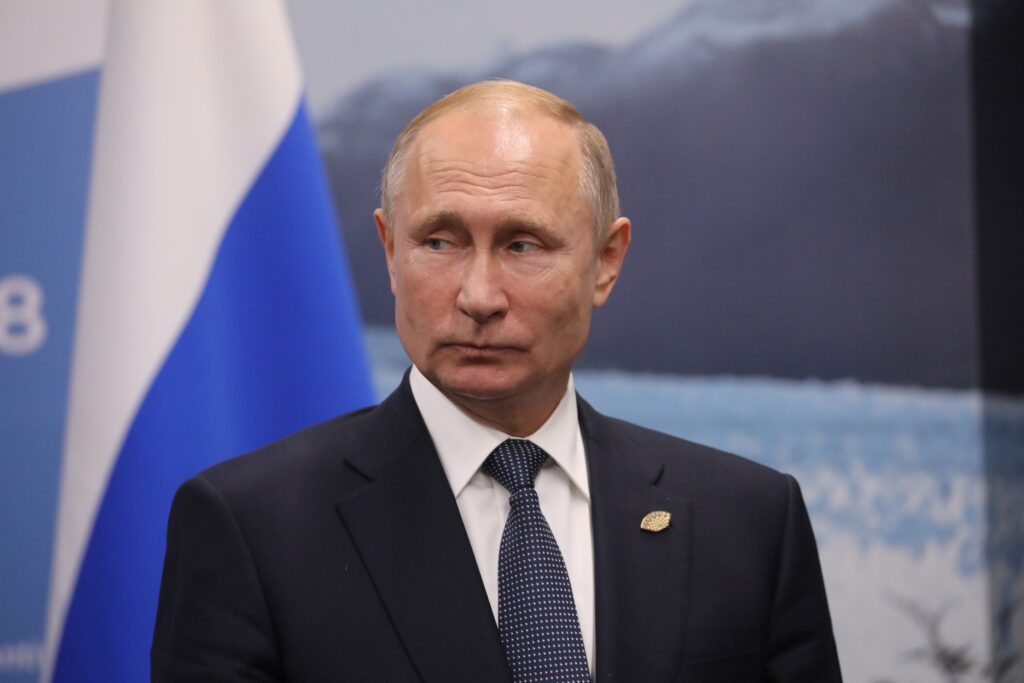 Russia's President Vladimir Putin gestures during a meeting with France's President Emmanuel Macron (out of frame) in the sidelines of the G20 Leaders' Summit in Buenos Aires, on November 30, 2018. - Global leaders gather in the Argentine capital for a two-day G20 summit beginning on Friday likely to be dominated by simmering international tensions over trade. (Photo by Ludovic MARIN / AFP)        (Photo credit should read LUDOVIC MARIN/AFP via Getty Images)